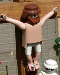 In this file photo, a Playmobil Jesus dies on the cross for your Legos